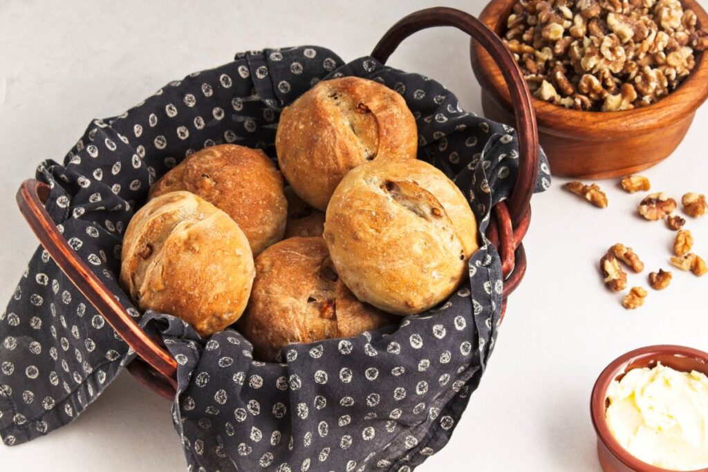 Crusty walnut loaves in a basket.