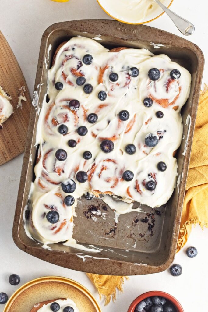 Lemon blueberry rolls in a pan.