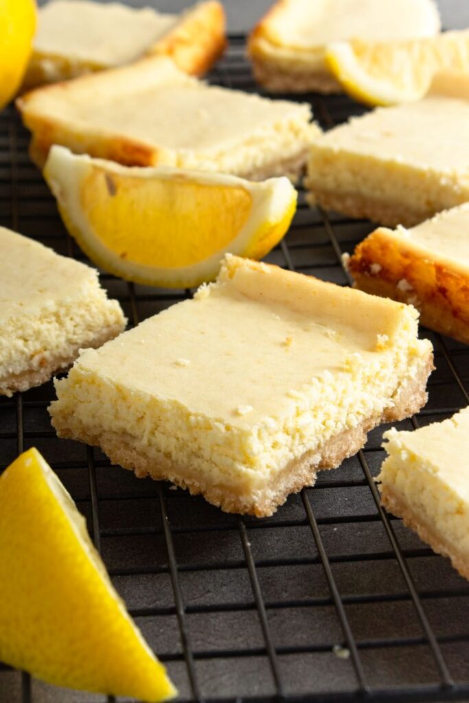 Ginger Lemon Cheesecake Bars on a baking rack.