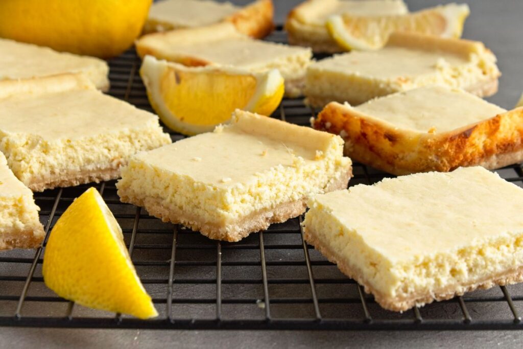 Ginger Lemon Cheesecake Bars on a baking rack.