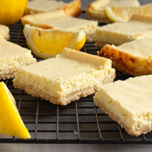 Ginger Lemon Cheesecake Bars on a baking rack.