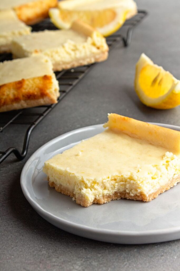 A Ginger Lemon Cheesecake Bar on a plate.