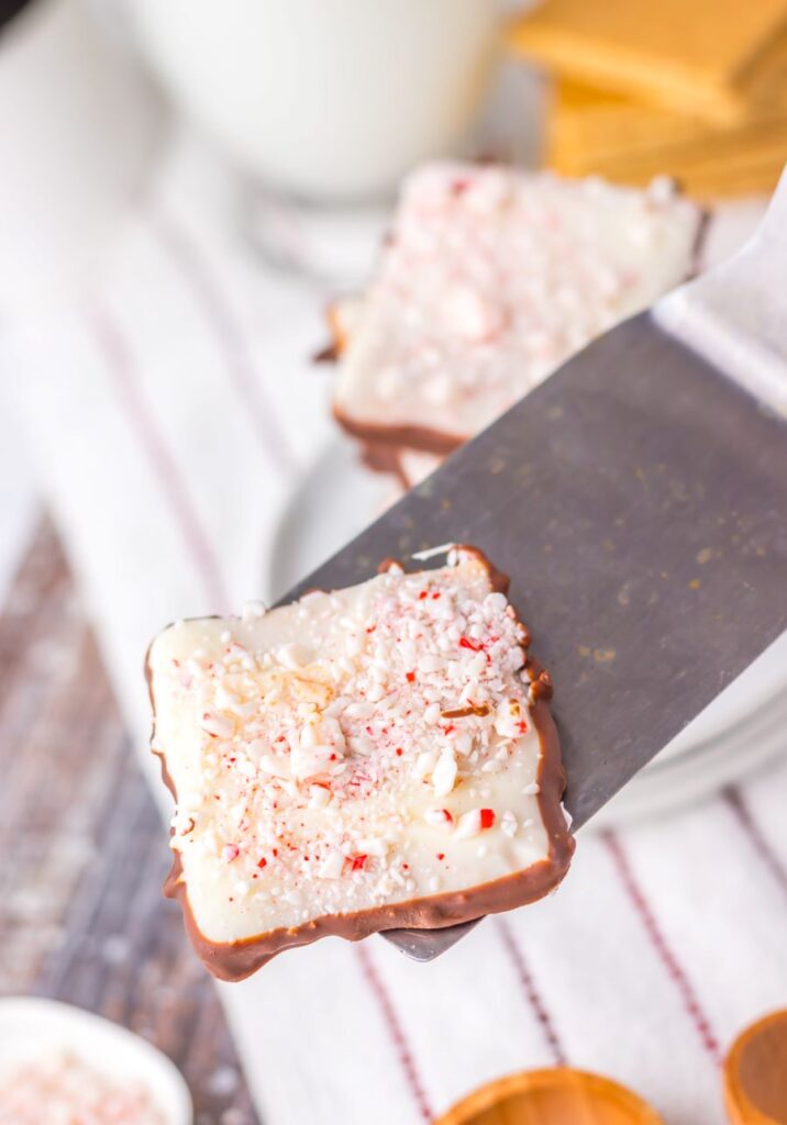 A Peppermint Bark Graham Cracker on a spatula.