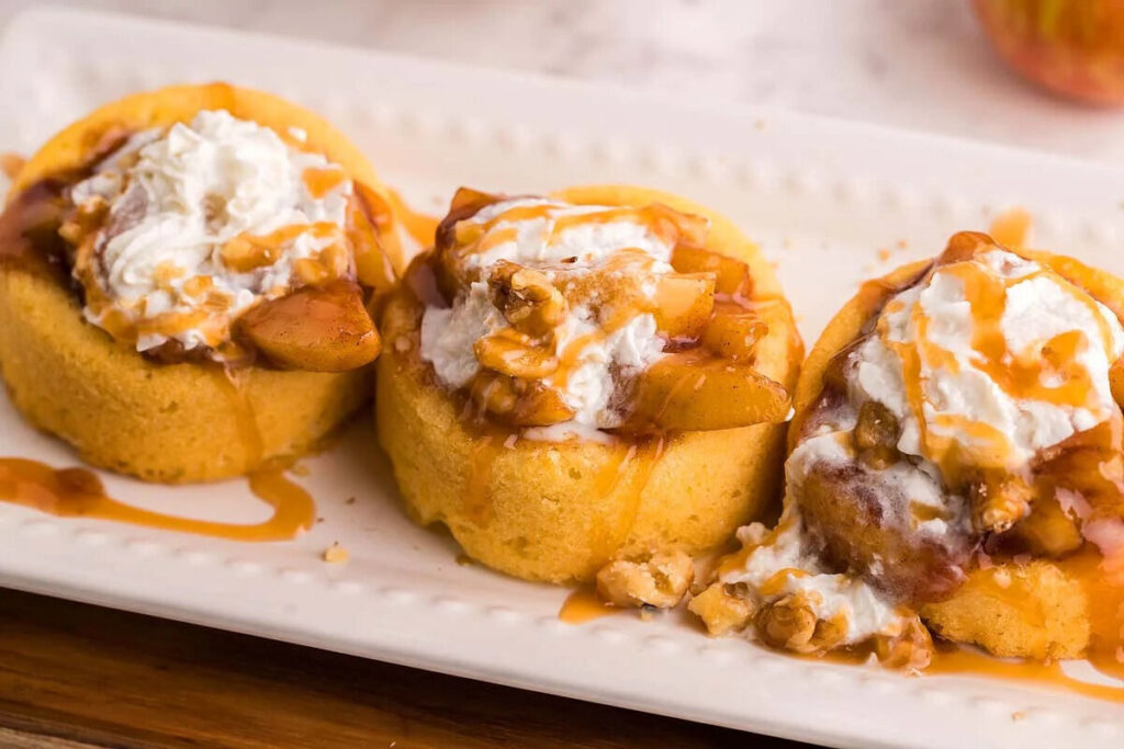 Three Instant Pot Fireball Apple Shortcakes on a white rectangular tray.