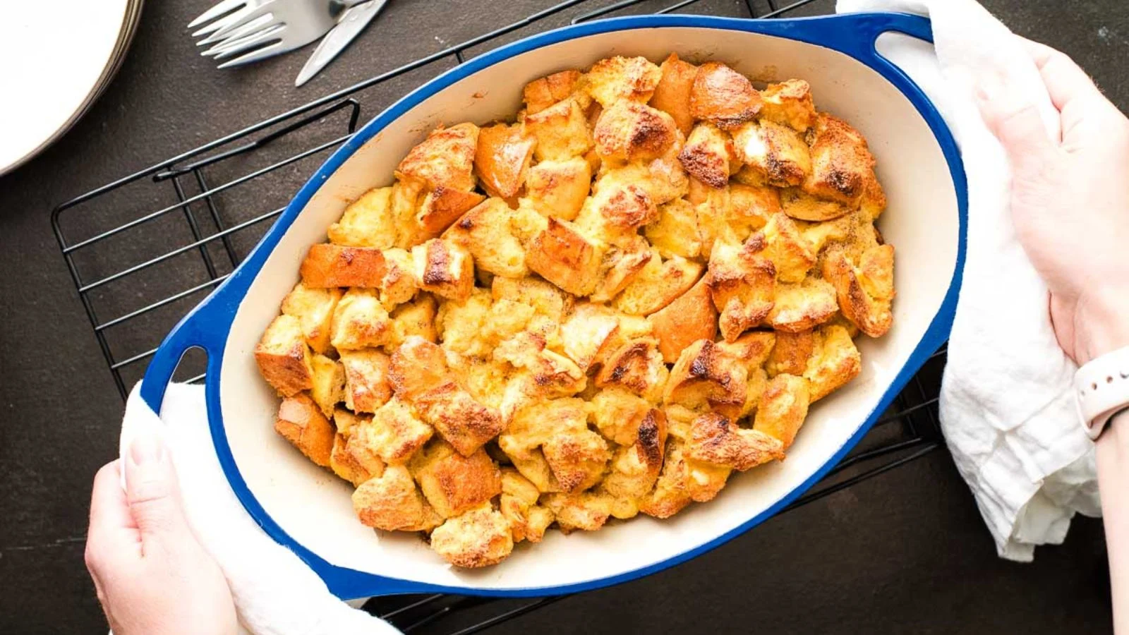 Overnight maple clementine French toast casserole in a white baking dish.