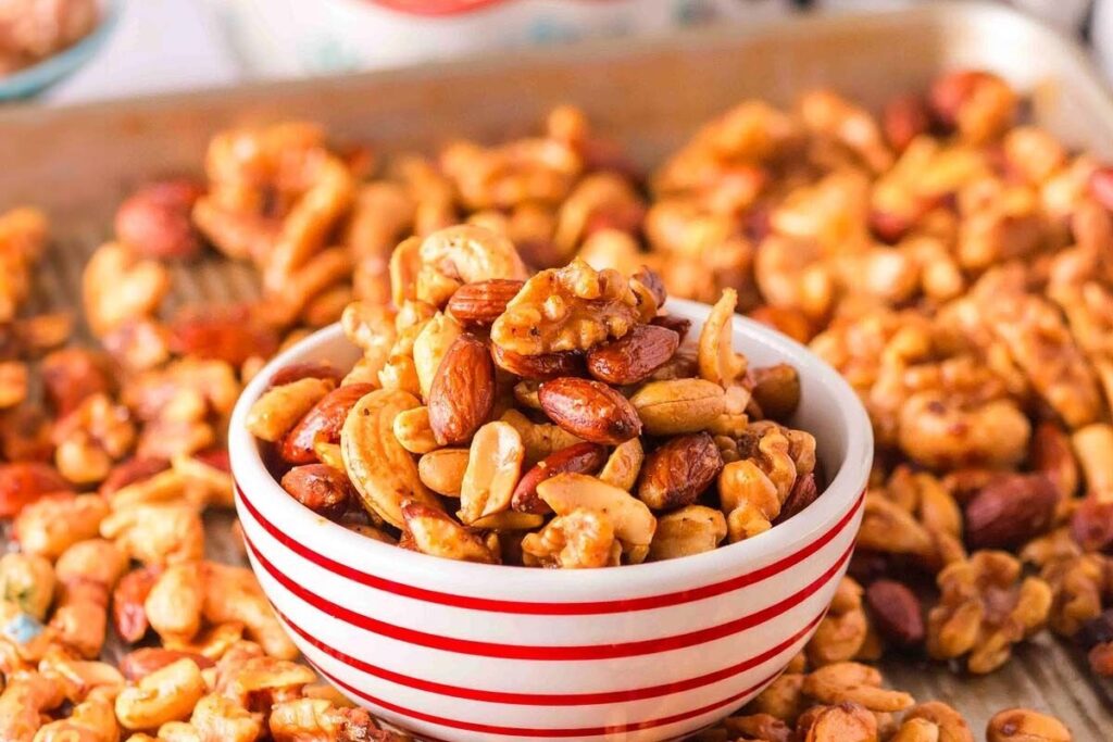 A bowl of sweet and spicy roasted party nuts.