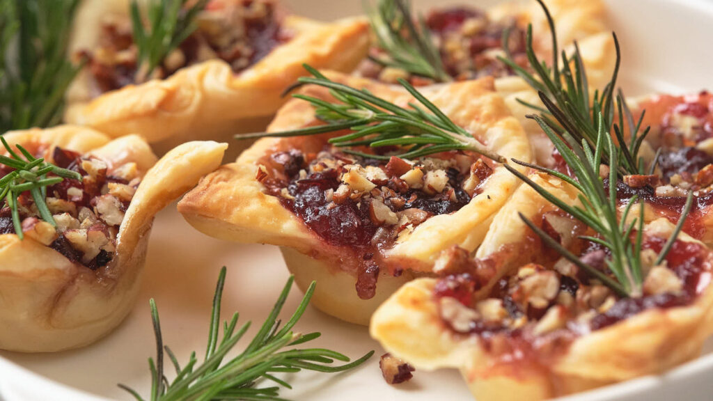 Cranberry bites on a white surface.