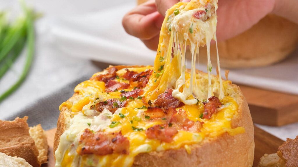 A close up shot of cheese and bacon cob loaf.