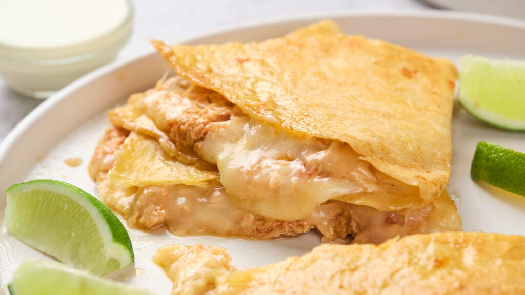 Chicken quesadillas on a white plate.