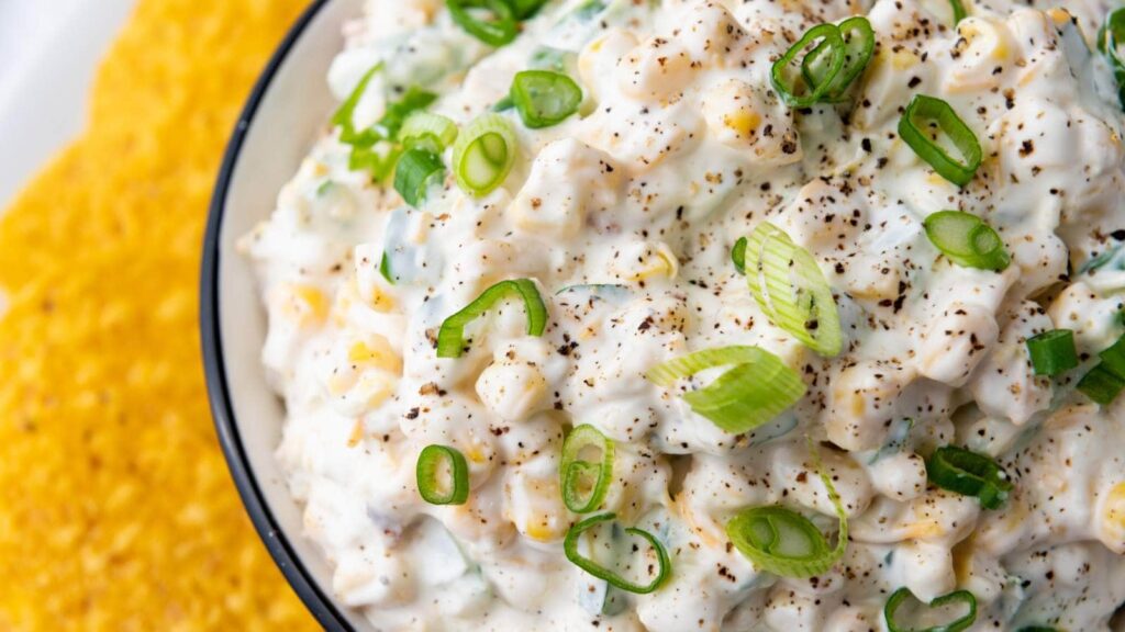 A bowl of creamy corn dip.