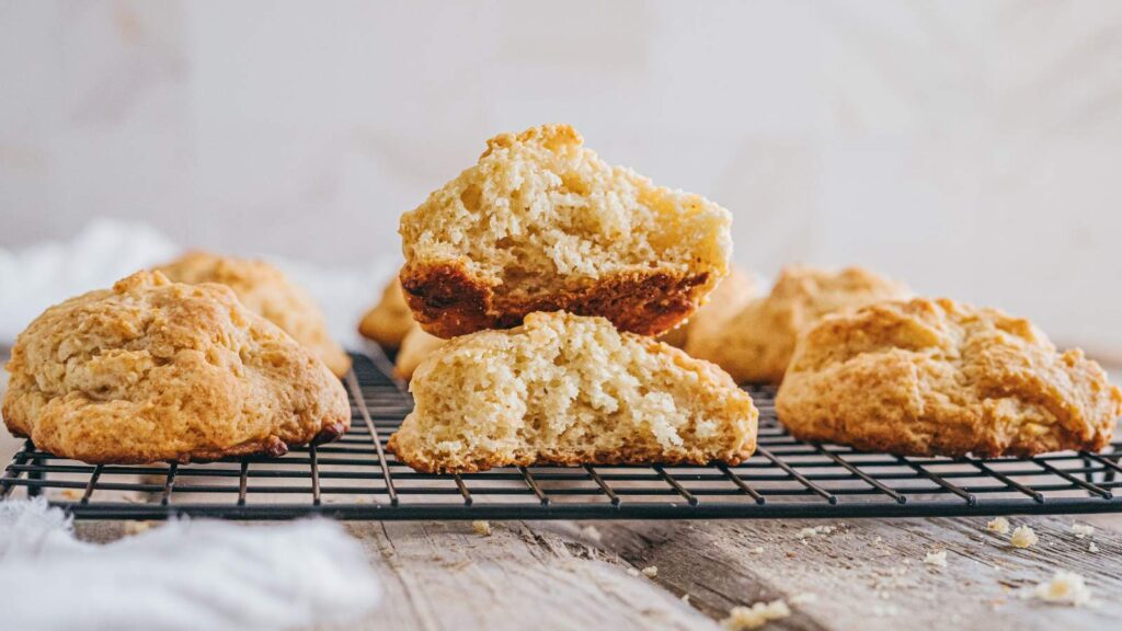 Drop biscuits resting on a wire rack.