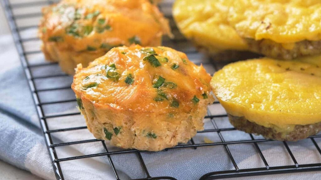 Egg muffins resting on a wire rack.