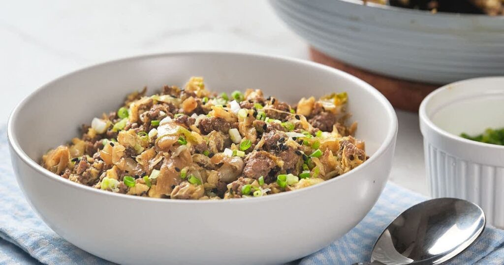 An egg roll dish in a white bowl.