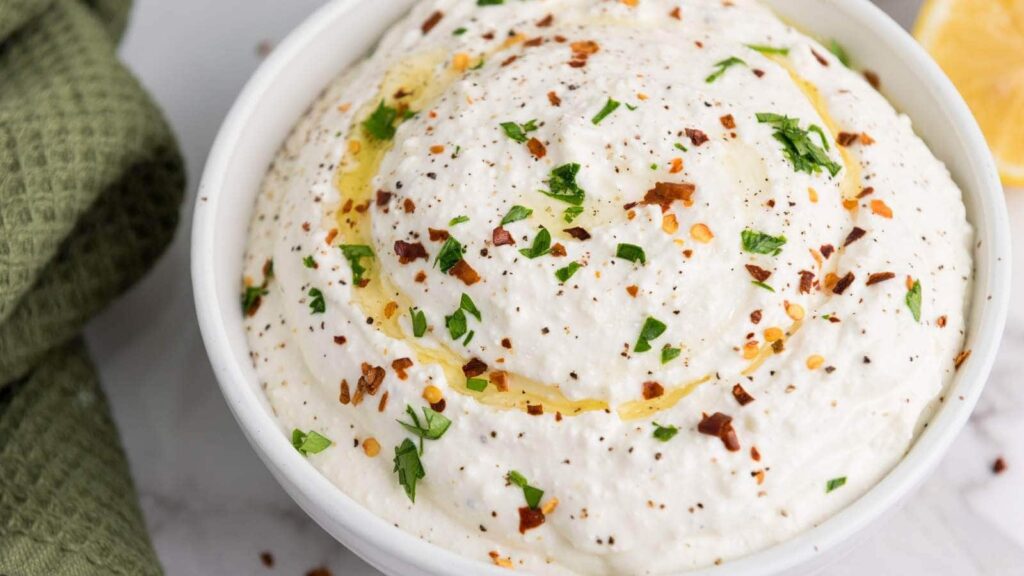 Feta dip in a white bowl.