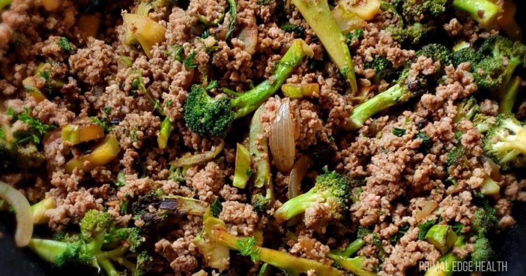 An upclose shot of cooked ground beef and broccoli.