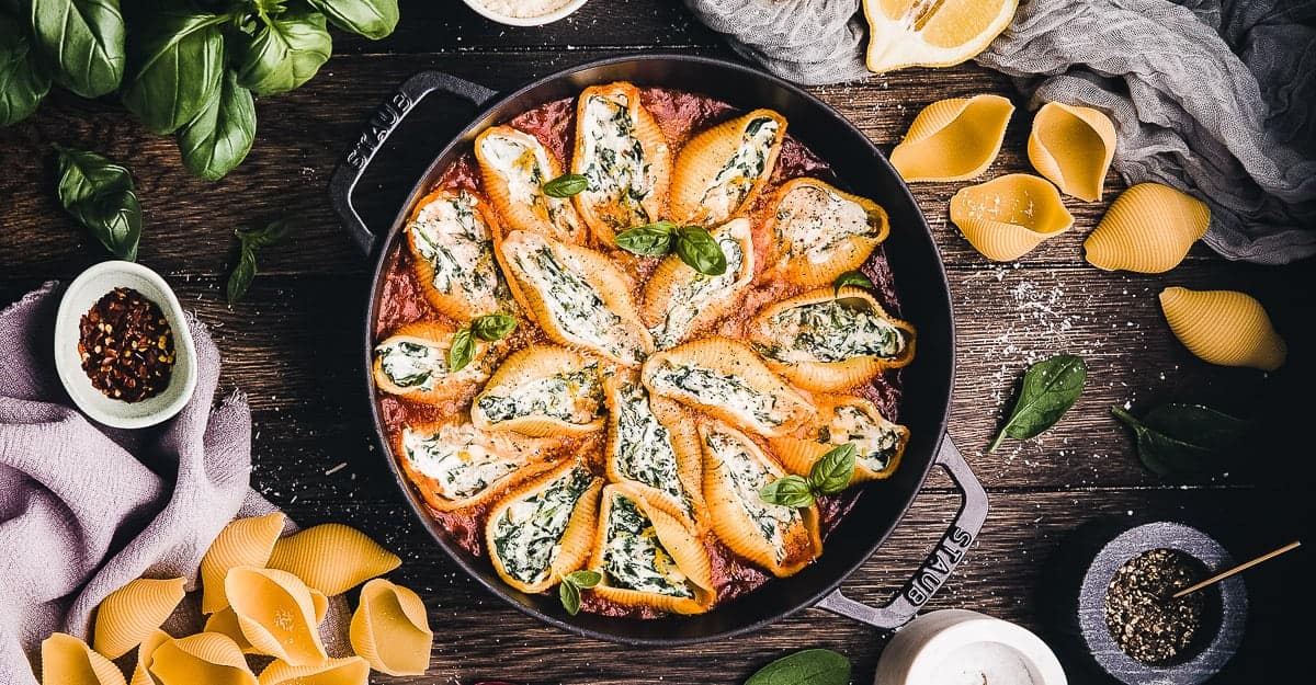 Stuffed shells in a cast iron skillet.