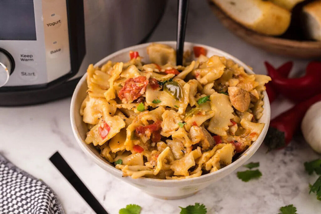 Instant Pot chicken Alfredo with vegetables for an easy weeknight meal.