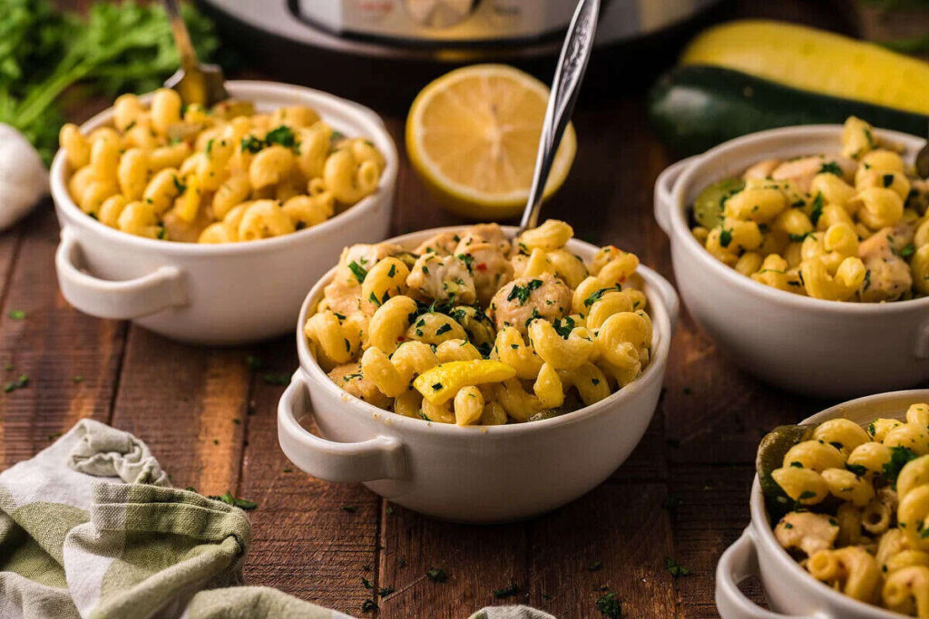 Lemon chicken pasta in a white bowl.