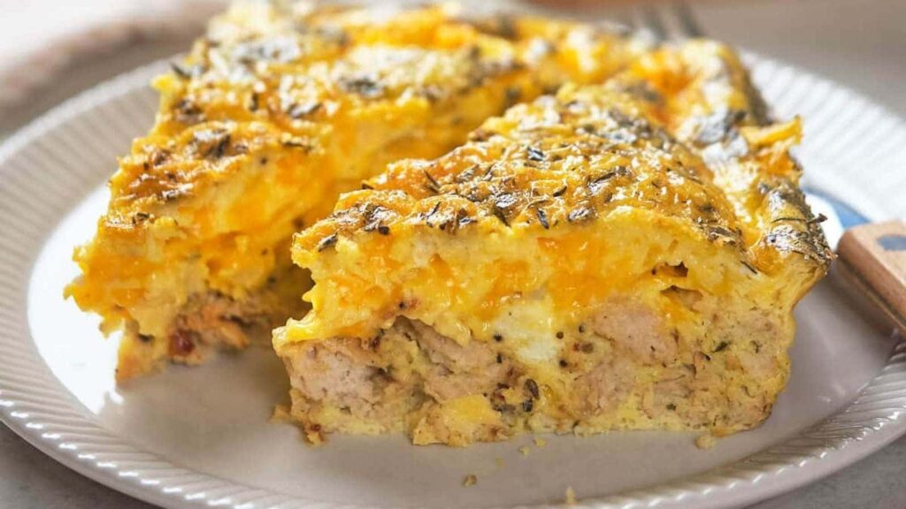 Two silces of breakfast casserole on a white plate.