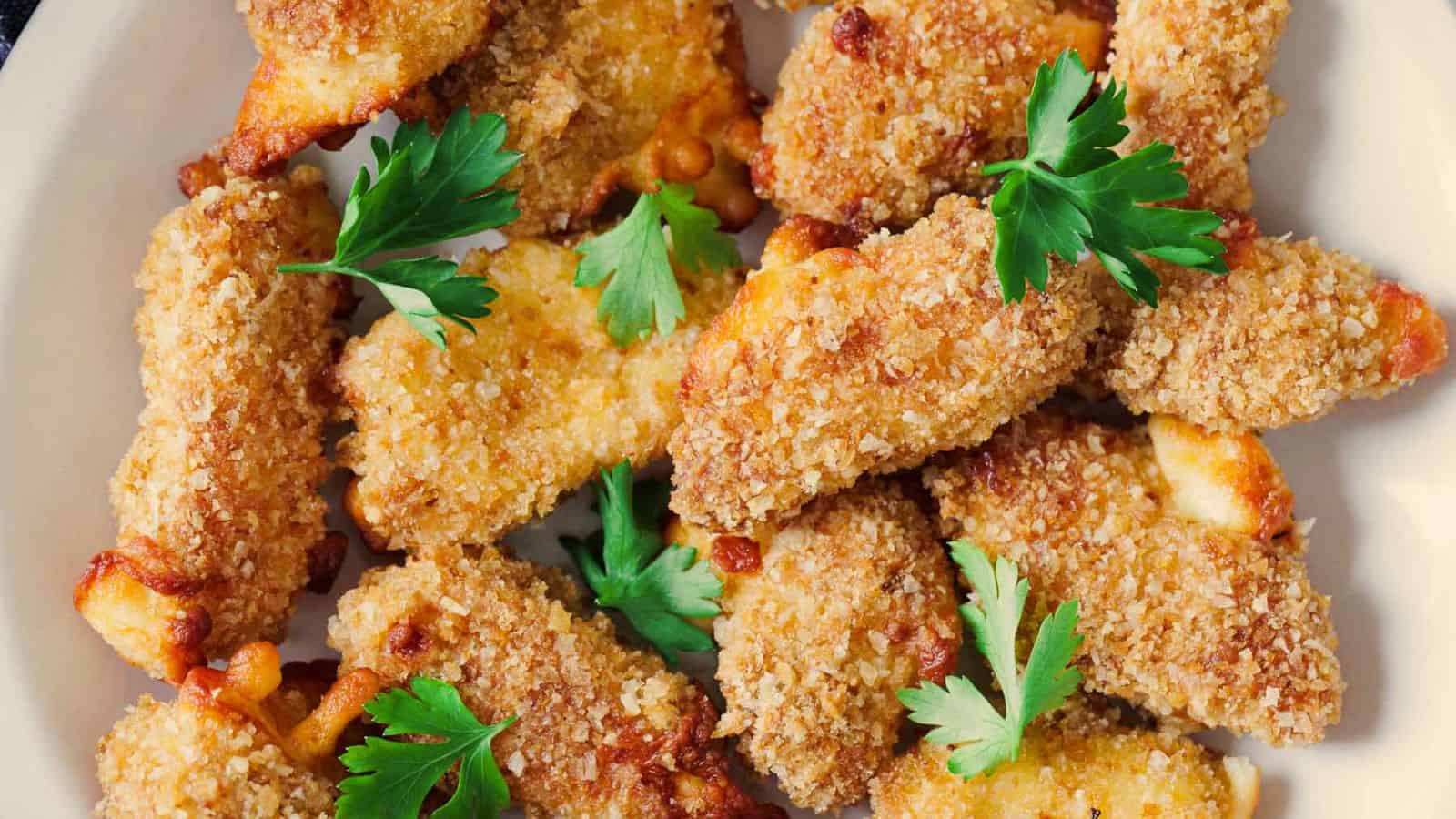 Air-fried cheese curds on a white plate.