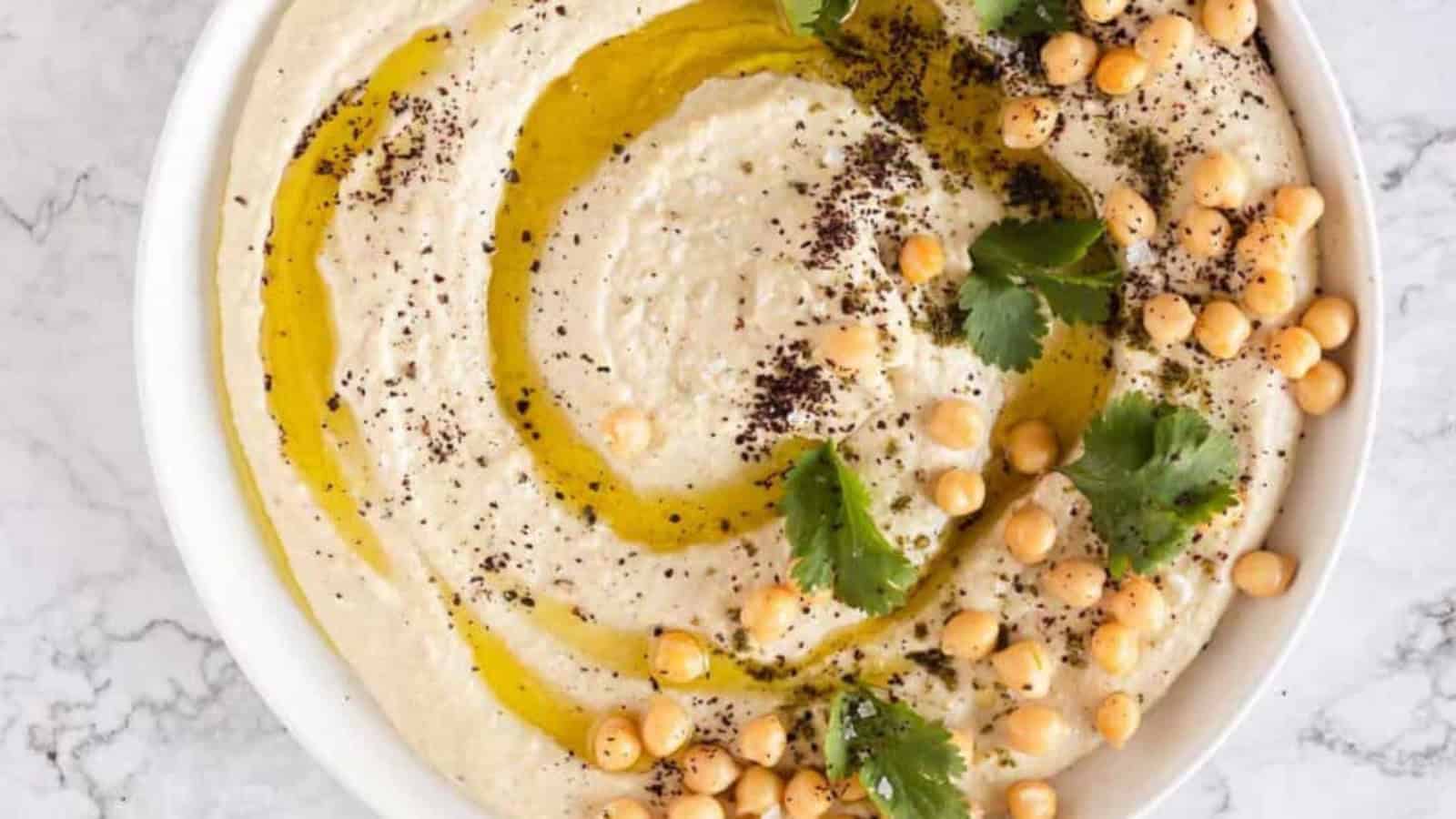 close up hummus on a plate.