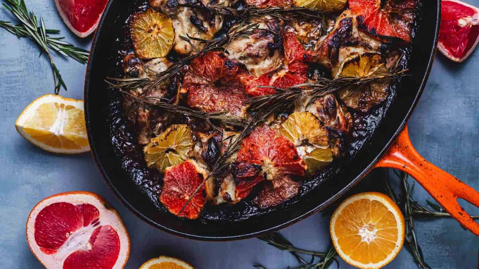 A creamy citrus‑rosemary chicken thigh on a white plate.
