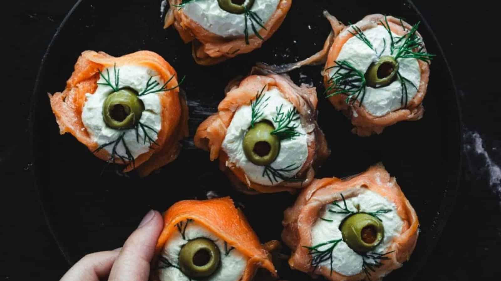 hand grabbing one of six Easy Smoked Salmon Canapes