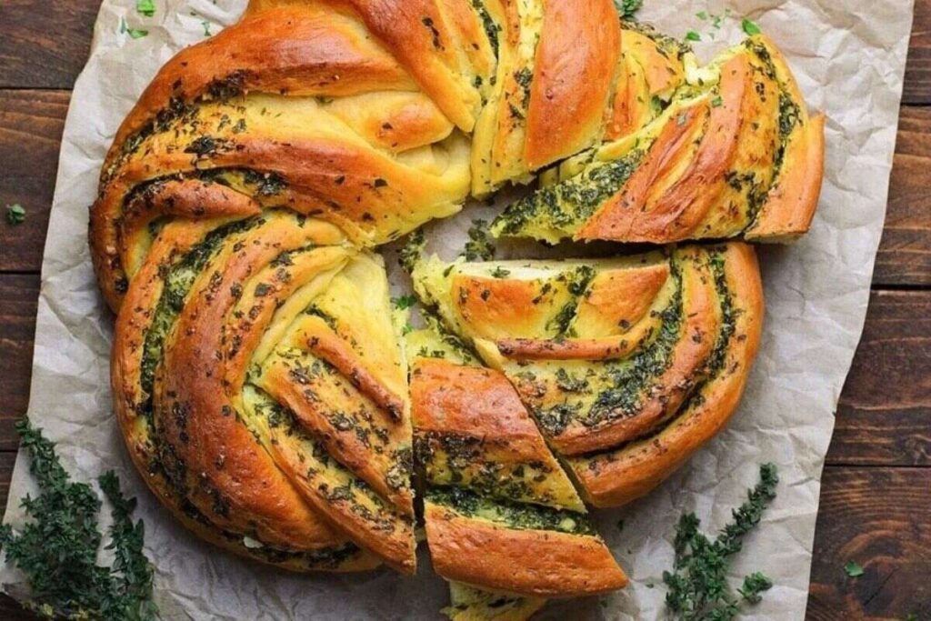A loaf of bread with a slice cut out of it, perfect for trying various bread recipes.