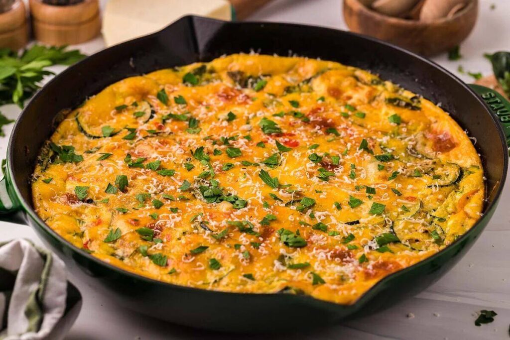 An Italian frittata sizzling with cheese and herbs.