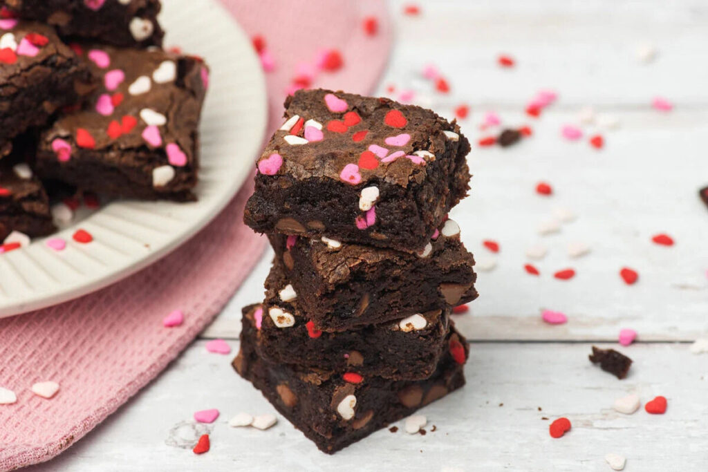 Fudgey chocolate brownies with sprinkles on top, a sweet Valentine treat.