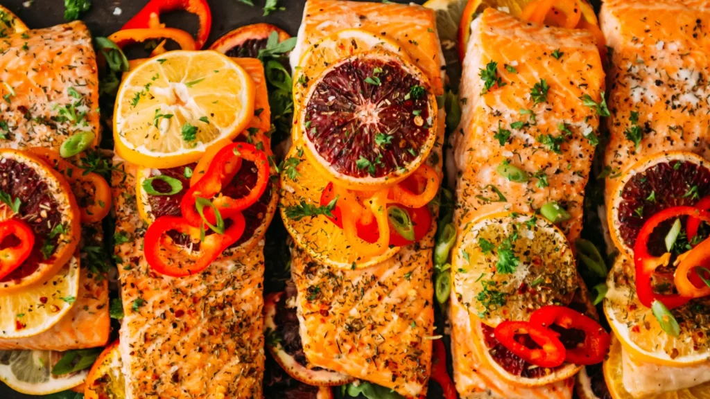 Baked citrus salmon roasted with lemon slices and herbs.