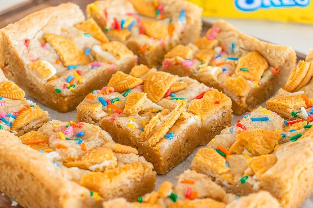 Oreo birthday brownies with golden cookie pieces and sprinkles.