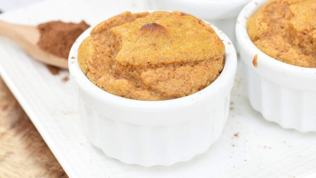 Pumpkin soulffe in a white ramekin.