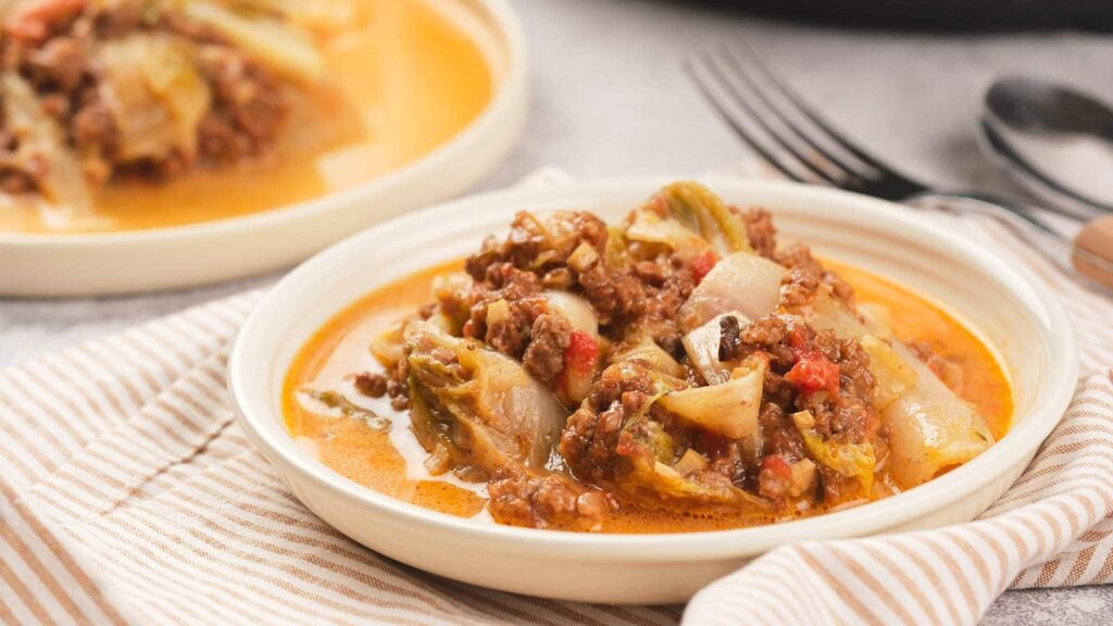 A lasagna dish on a white plate.