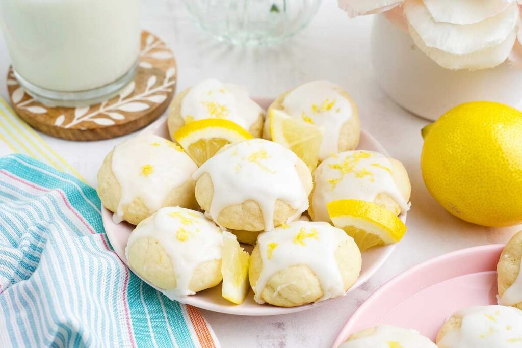Lemon ricotta cookies with icing and a sprinkle of lemon zest.