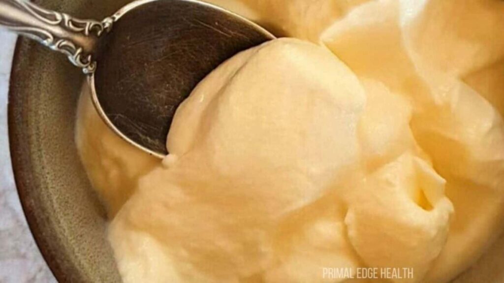 A spoon scooping a portion of cheesecake fluff.
