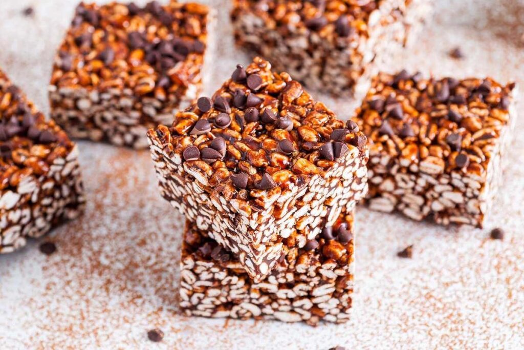 Three stacked chocolate puffed wheat squares.