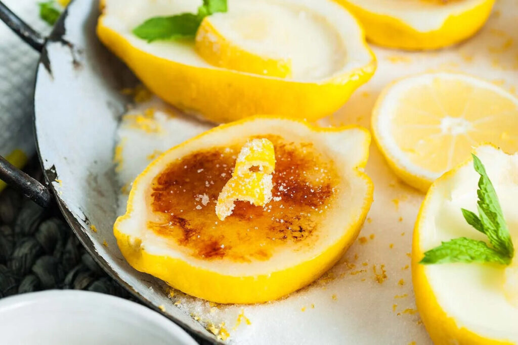 A lemon dessert served in a lemon shell.