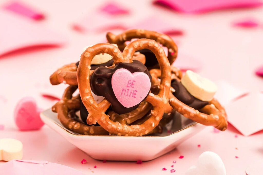 Valentine's Day pretzels on a pink background.
