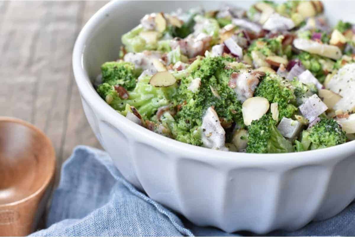 A bowl of broccoli salad with bacon.