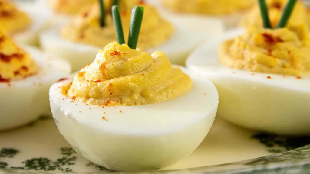 Close up of a deviled eggs on a serving plate.