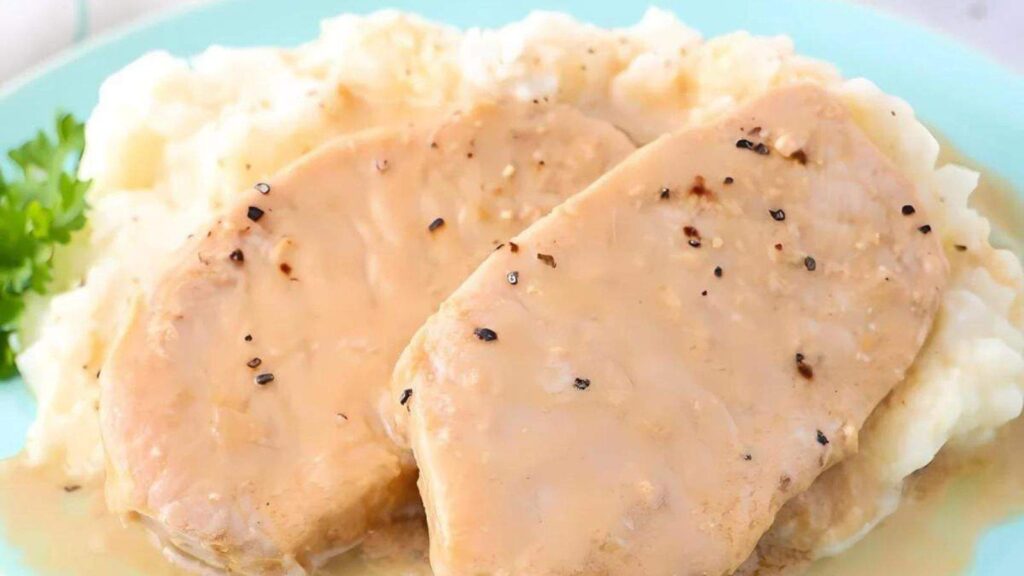 Tender pork chops slow-cooked with a savory sauce.