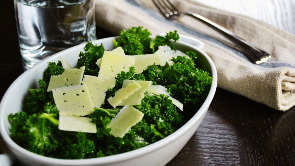 Rubbed Kale Salad with Parmesan in a white bowl.