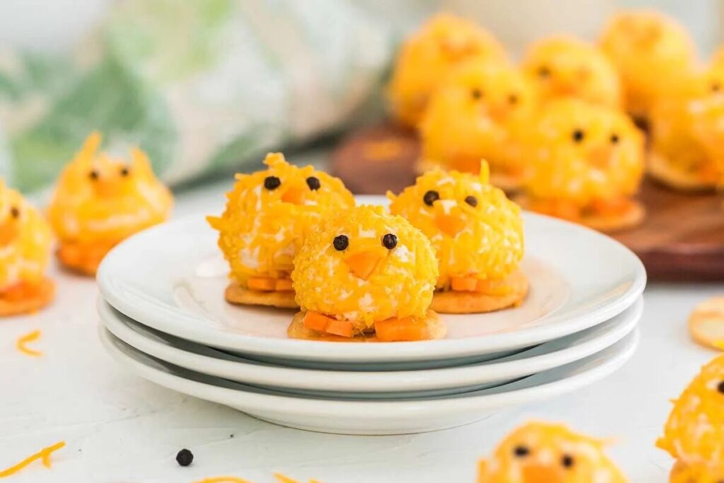 Cheesy chick crackers on a plate, perfect for Easter appetizers.
