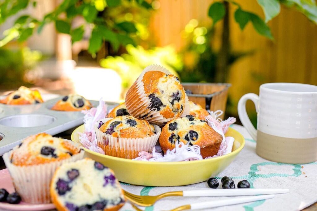blueberry muffins on a table.