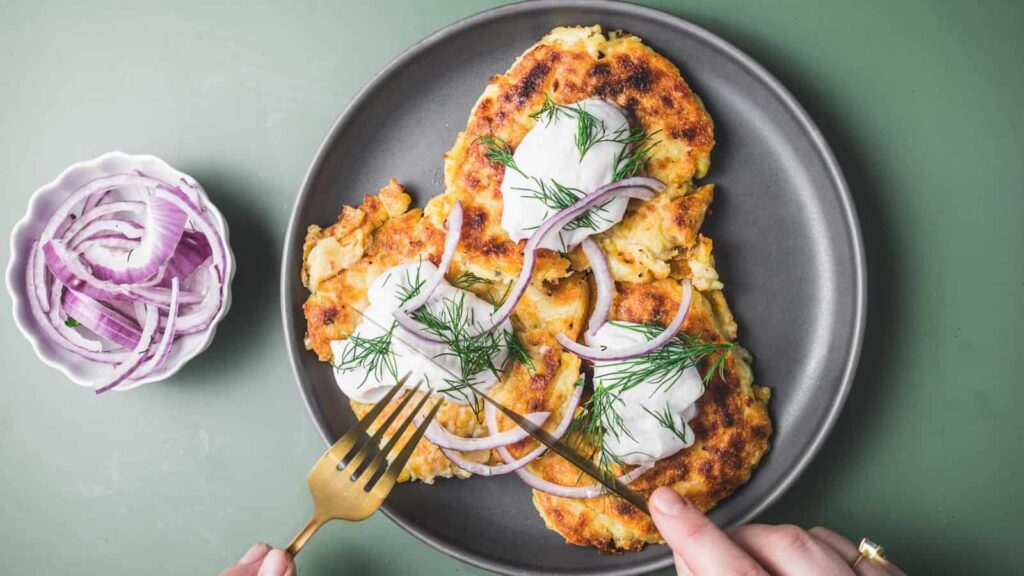 Golden Irish boxty potato pancakes stacked on a plate.