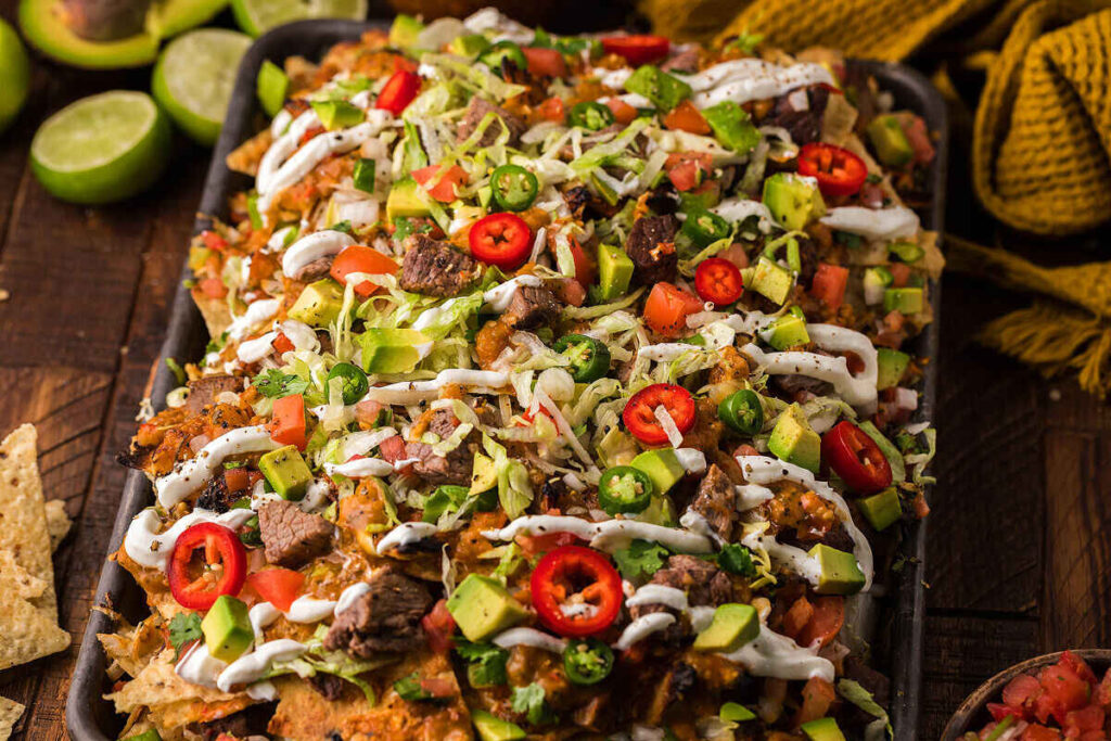 A sheet pan full of steak nachos.