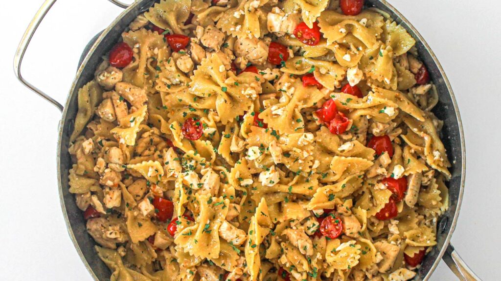 White wine chicken pasta in a skillet.