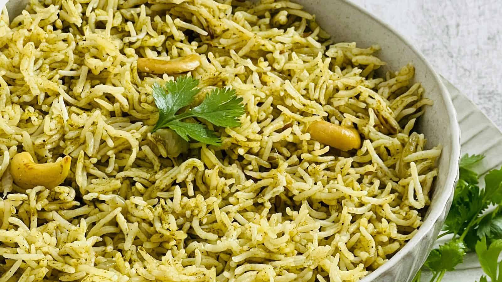 Close-up of a bowl of Cilantro Rice garnished with parsley, highlighting the texture and color of the dish.