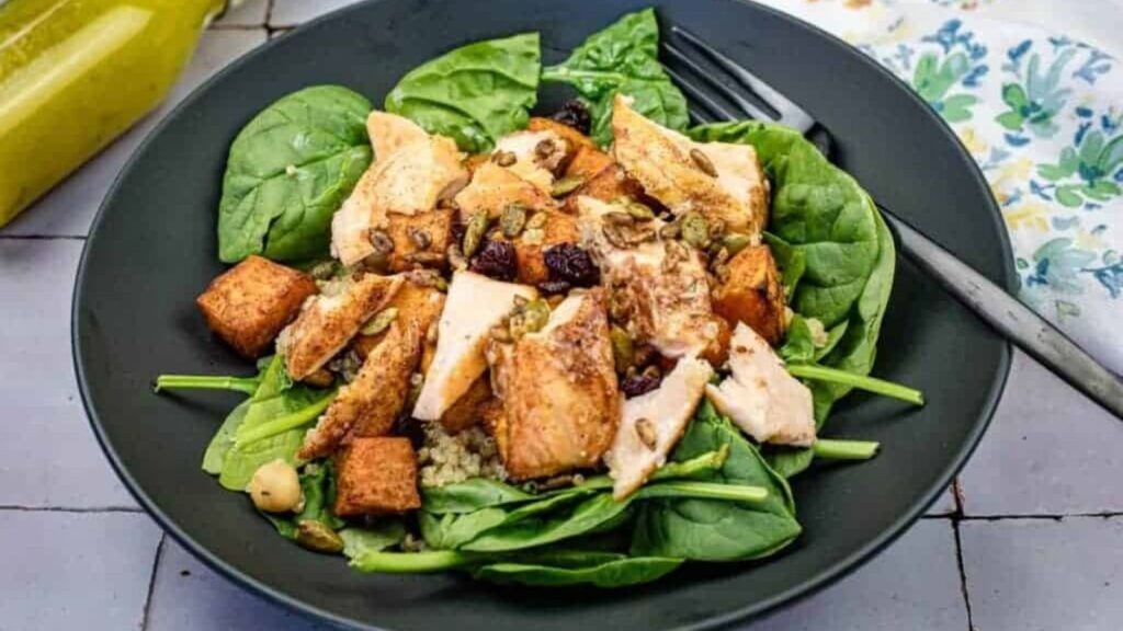 Salmon bowl on a black plate.